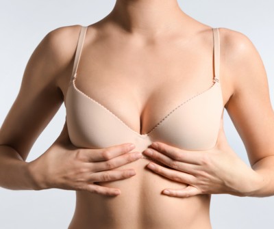 How is breast ptosis correction performed?